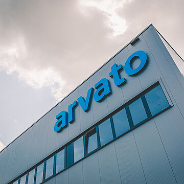 A warehouse building with Arvato logo